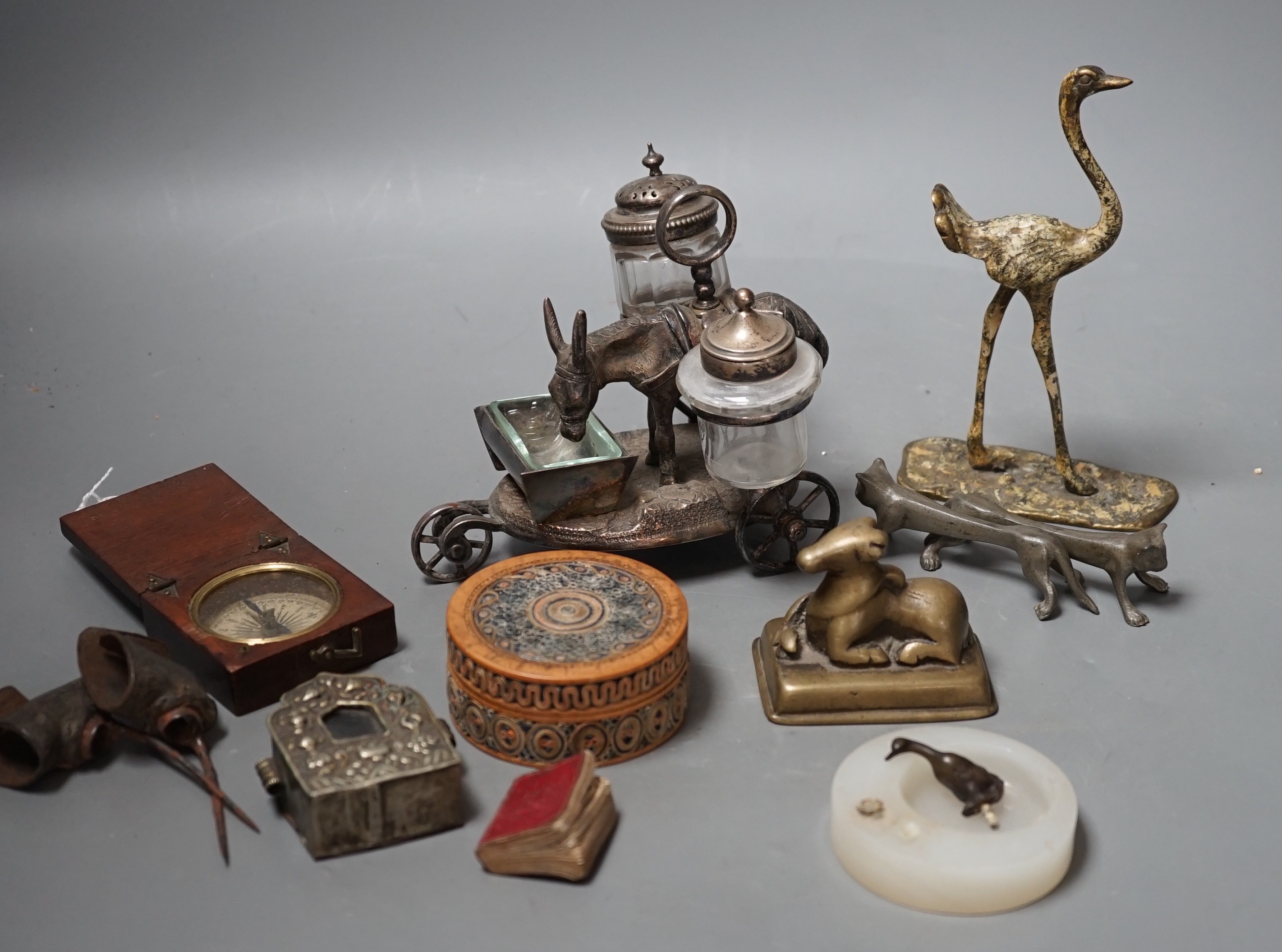 A selection of various miscellaneous items, to include a pair of 19th century cock fighting spurs, a rolled paperwork circular box and cover, a novelty plated donkey cruet, Tibetan box etc.